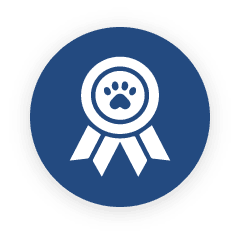 icon of ribbon medal with paw print inside a blue circle