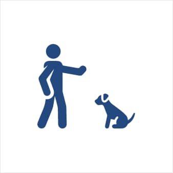 A simple graphic of a person standing with an outstretched hand toward a sitting dog.