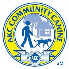 AKC Community Canine logo featuring a person walking a dog in front of a house, enclosed in a yellow circle border.