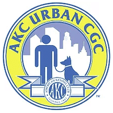 Logo of the AKC Urban CGC program featuring a human figure and a dog in front of a city skyline, with "AKC URBAN CGC" written in a circular border and the American Kennel Club emblem below.